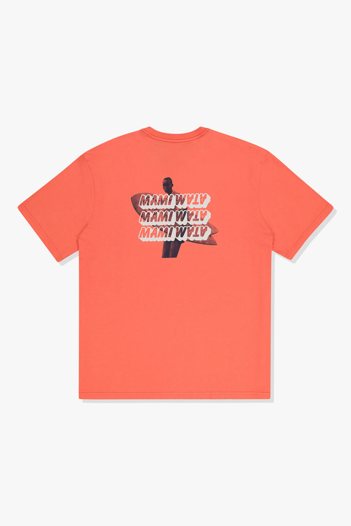 Back of Mami Wata 3 Mami Surf Tee in coral with three stacked Mami Wata word marque logo's over surfer silhouette