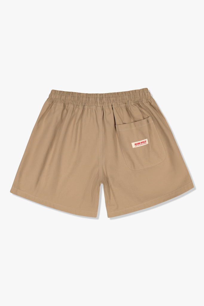 Back view of Mami Wata Off the Beach Walk Short in cotton twill with back patch pocket.